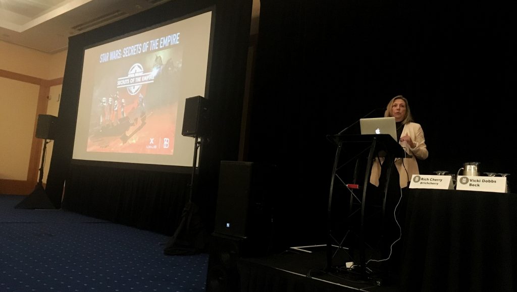 ILMxLab Executive in Charge, Vicki Dobbs Beck, stands behind a podium.