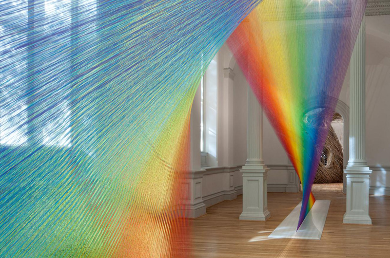 interior of Renwick Gallery during WONDER exhibition, showing rainbow colored strands of thread that form Plexus A1, by Gabriel Dawe