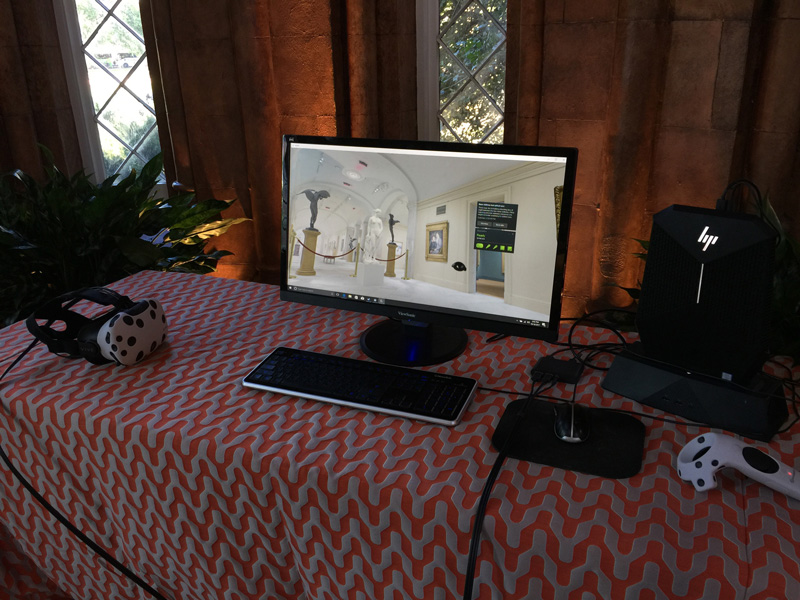 Table holding computer, monitor and HTC Vive headset and controller