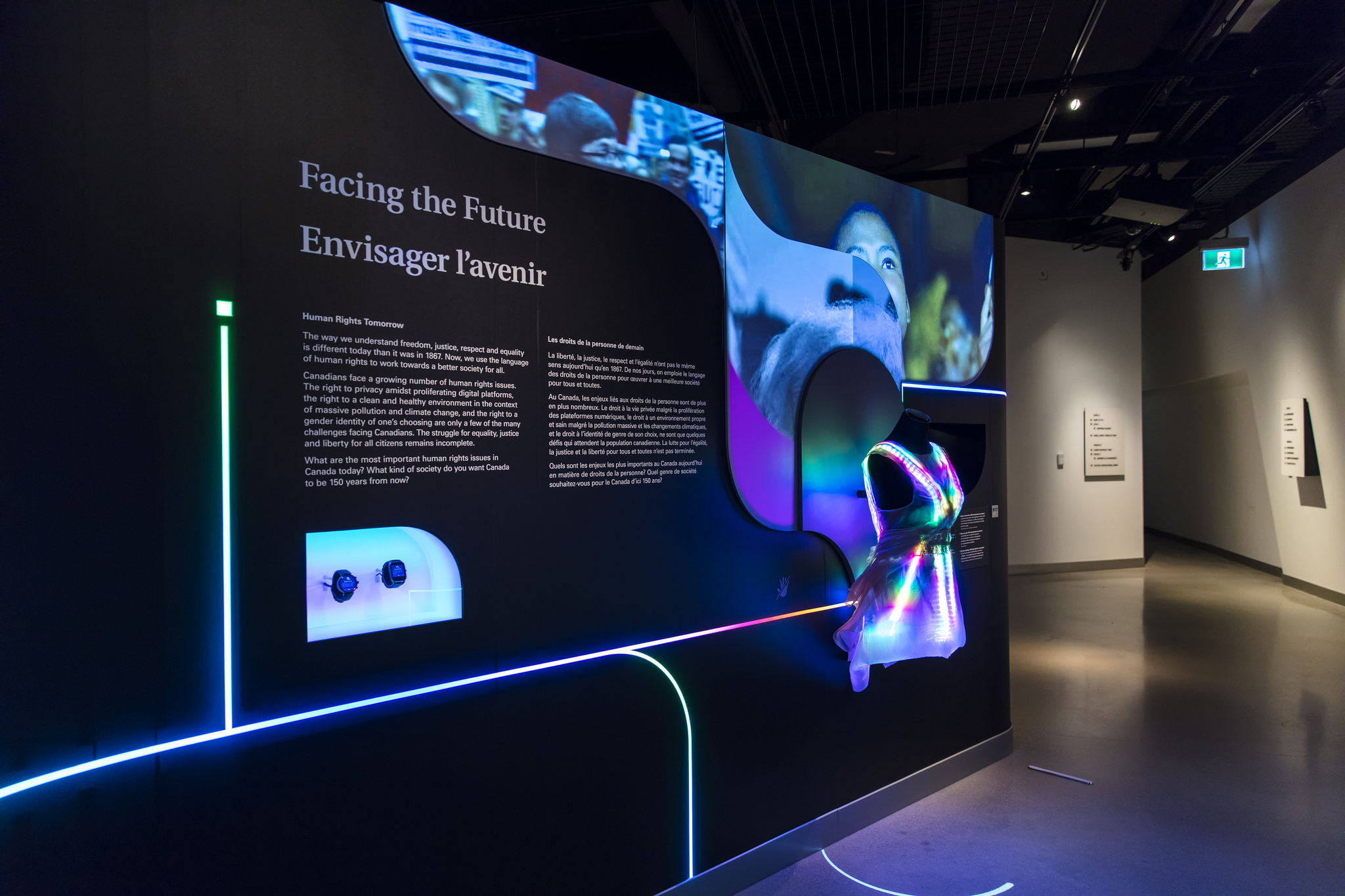 A dress in the right hand side is glowing with lights that are embedded in the fabric.