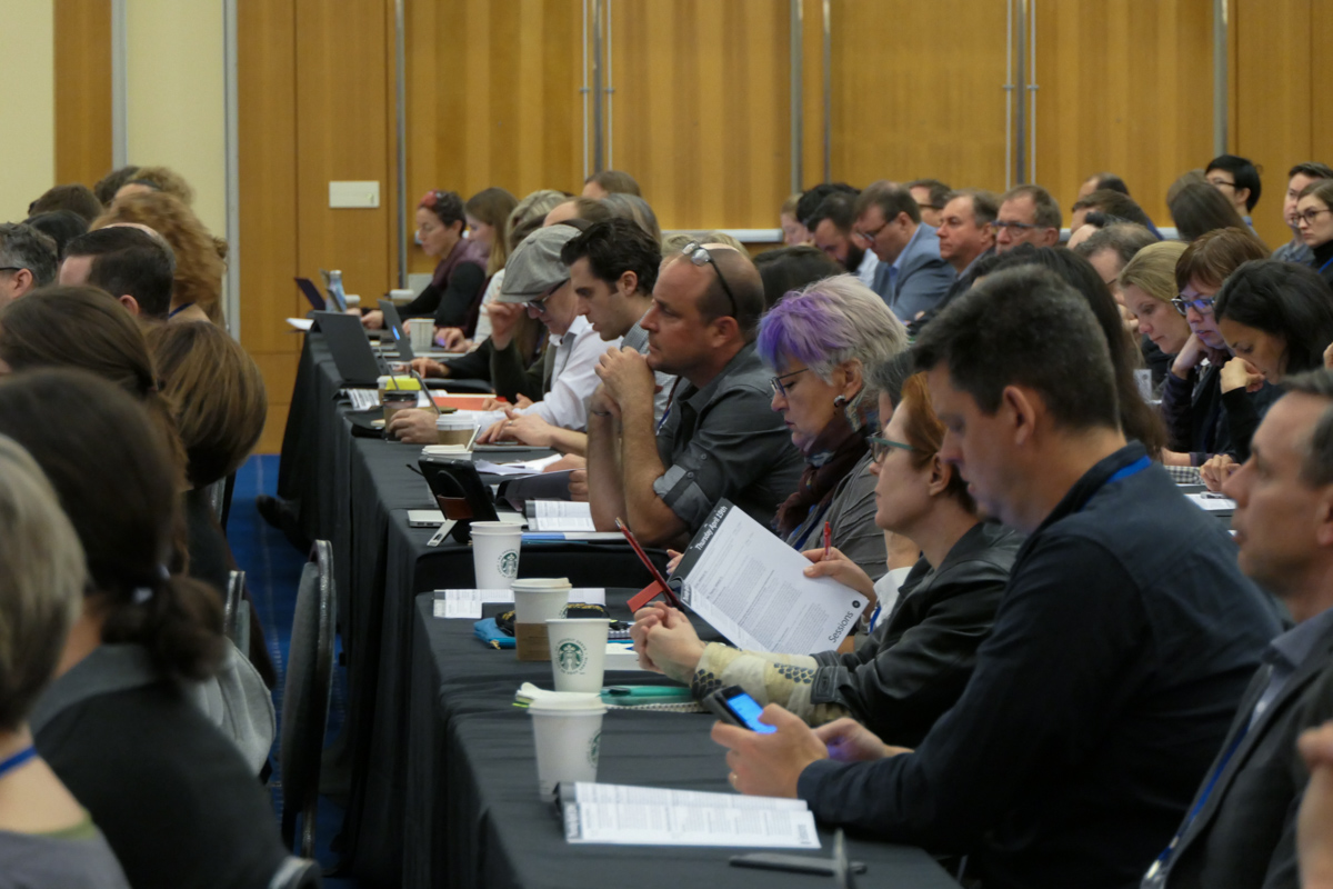 A crowded room of MW18 conference goers.